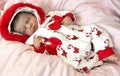 Reborn Baby Doll that is 20 inches in a Red and White Candy Cane Furry Hooded Outfit
