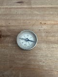 Small vintage pocket compass with mirrored back